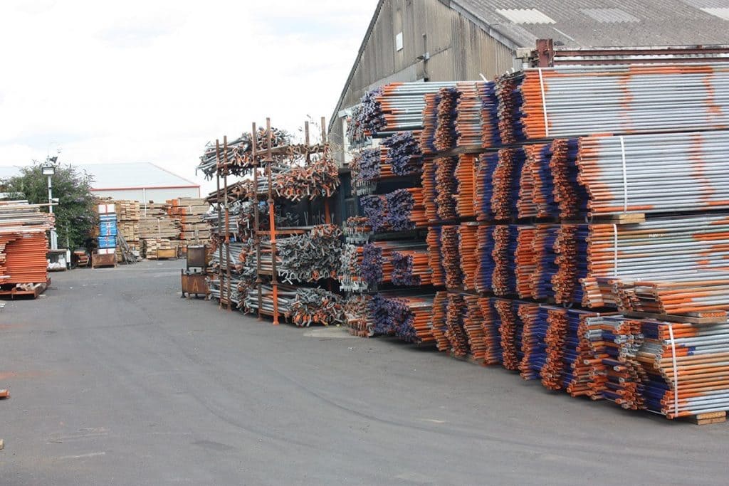 Neatly piled scaffolding material.